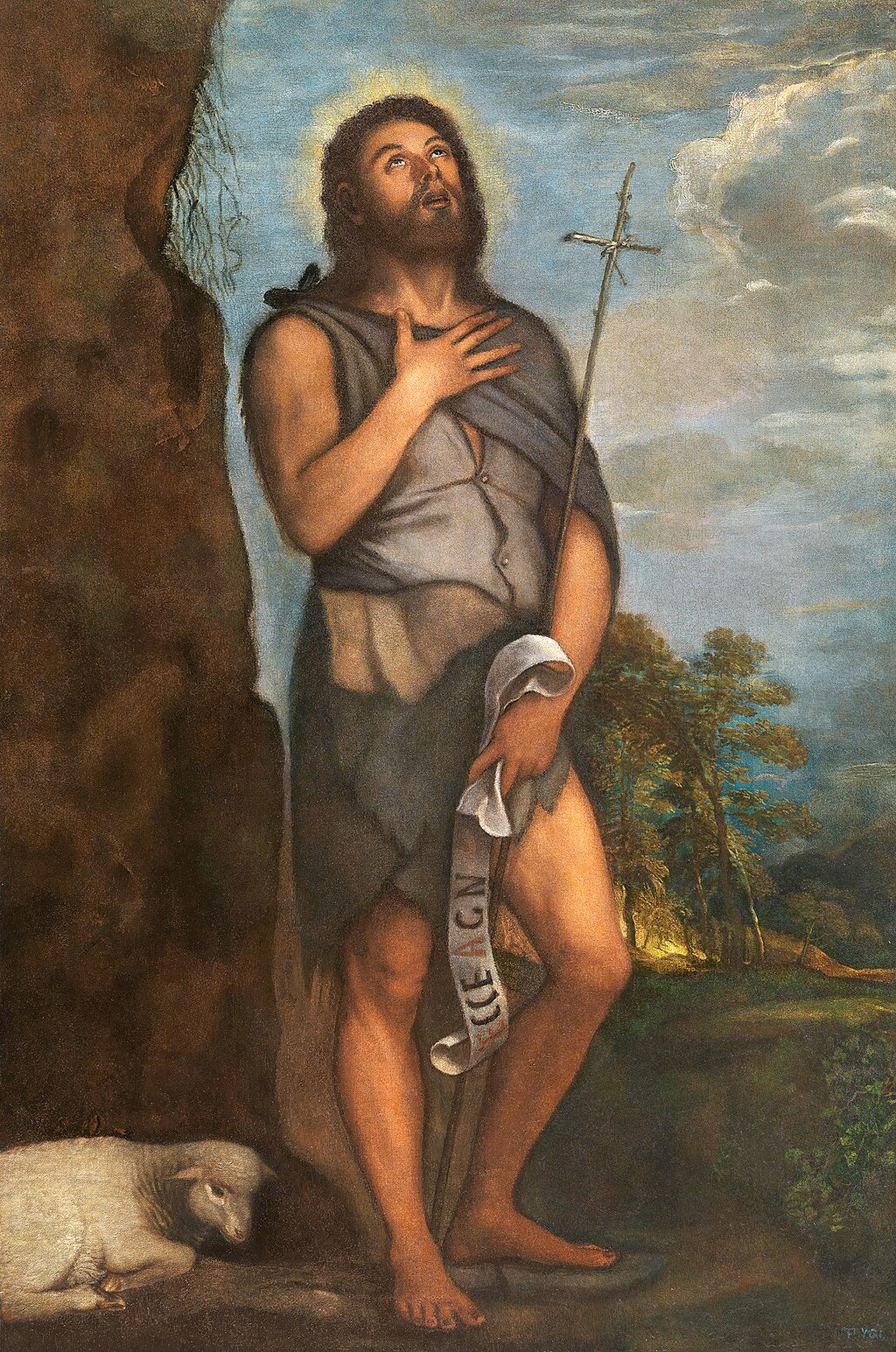 Saint John the Baptist by Titian | Museo del Prado Madrid. Painting of a bearded man in a landscape with a cross and scroll, possibly a religious figure.