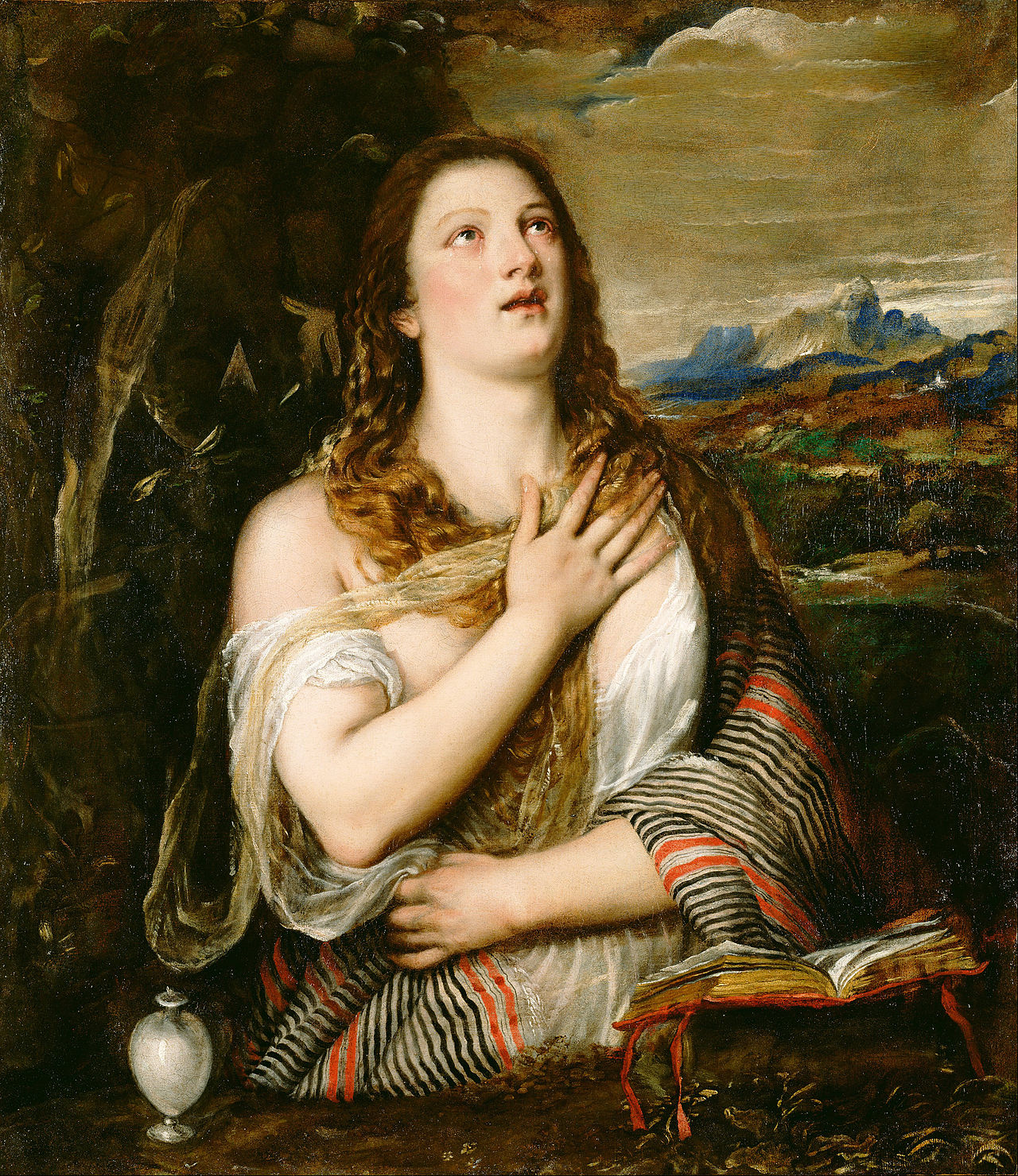 Penitent Magdalene (c. 1555–1565) by Titian | Getty Center. Painting of a woman in a natural setting with a landscape in the background