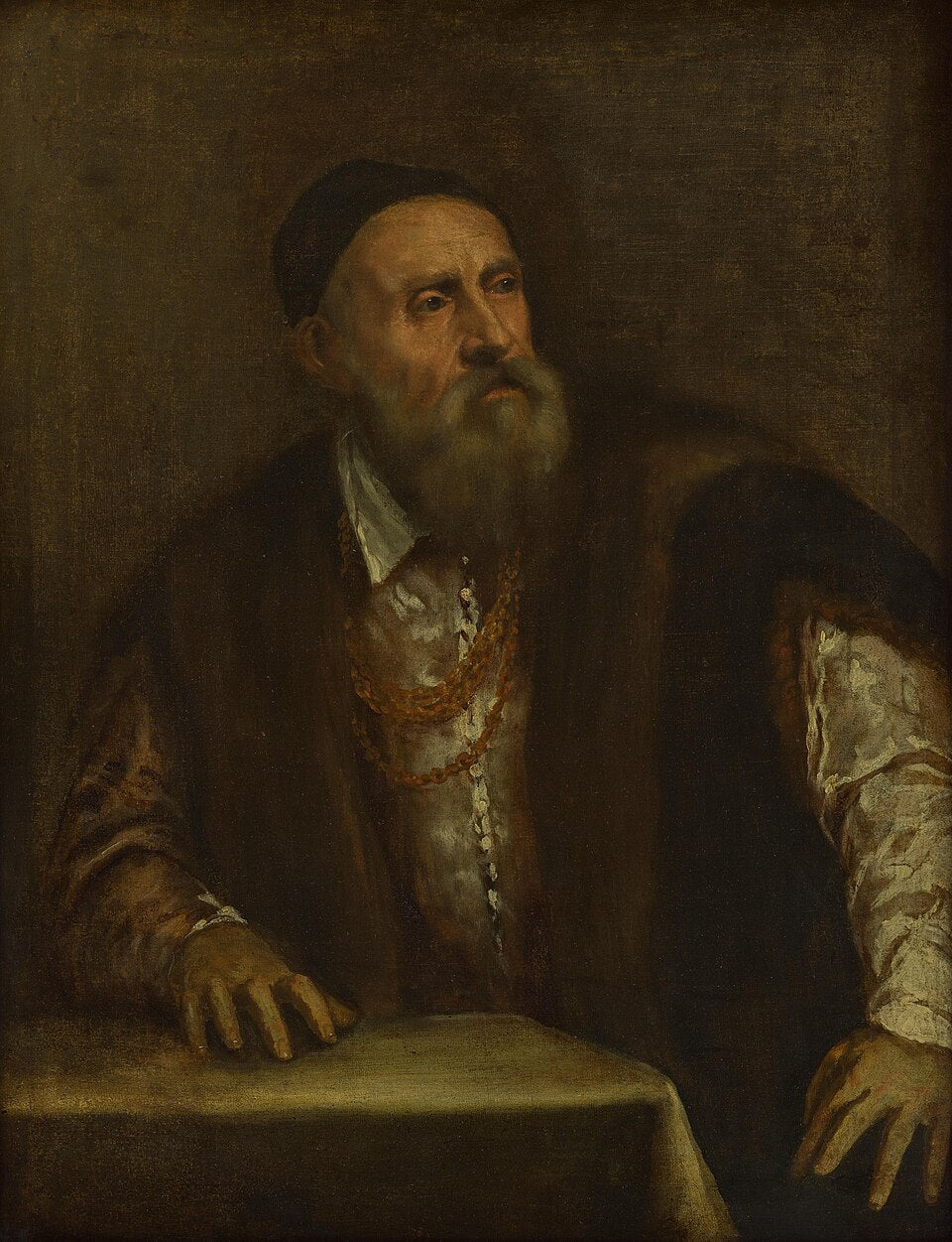 Self-Portrait by Titian – Renaissance Masterpiece, Gemäldegalerie Berlin. Portrait of a man with a beard wearing a dark robe and a hat, sitting at a table.