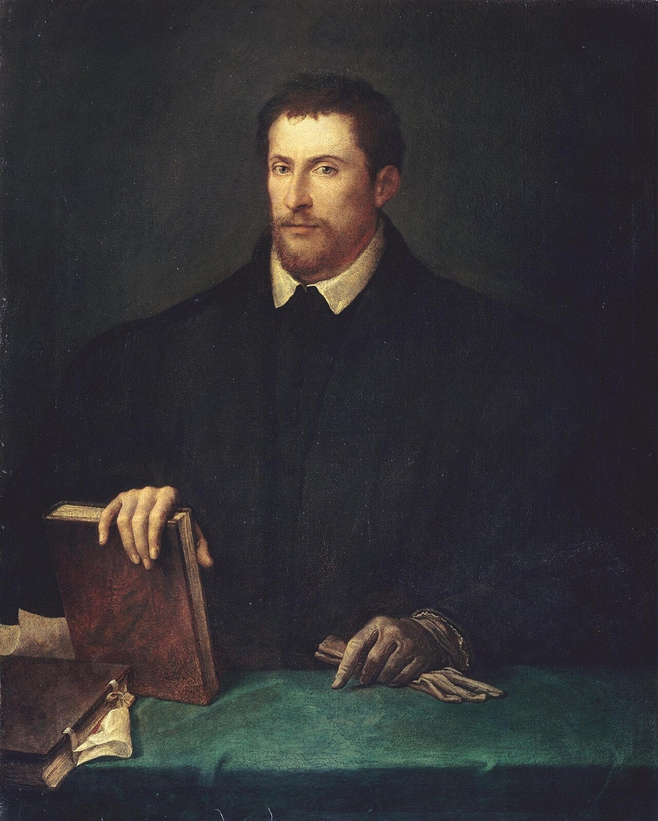 Portrait of Ippolito Riminaldi by Titian – Renaissance Masterpiece, Accademia di San Luca Rome. Portrait of a man holding books on a table against a dark background