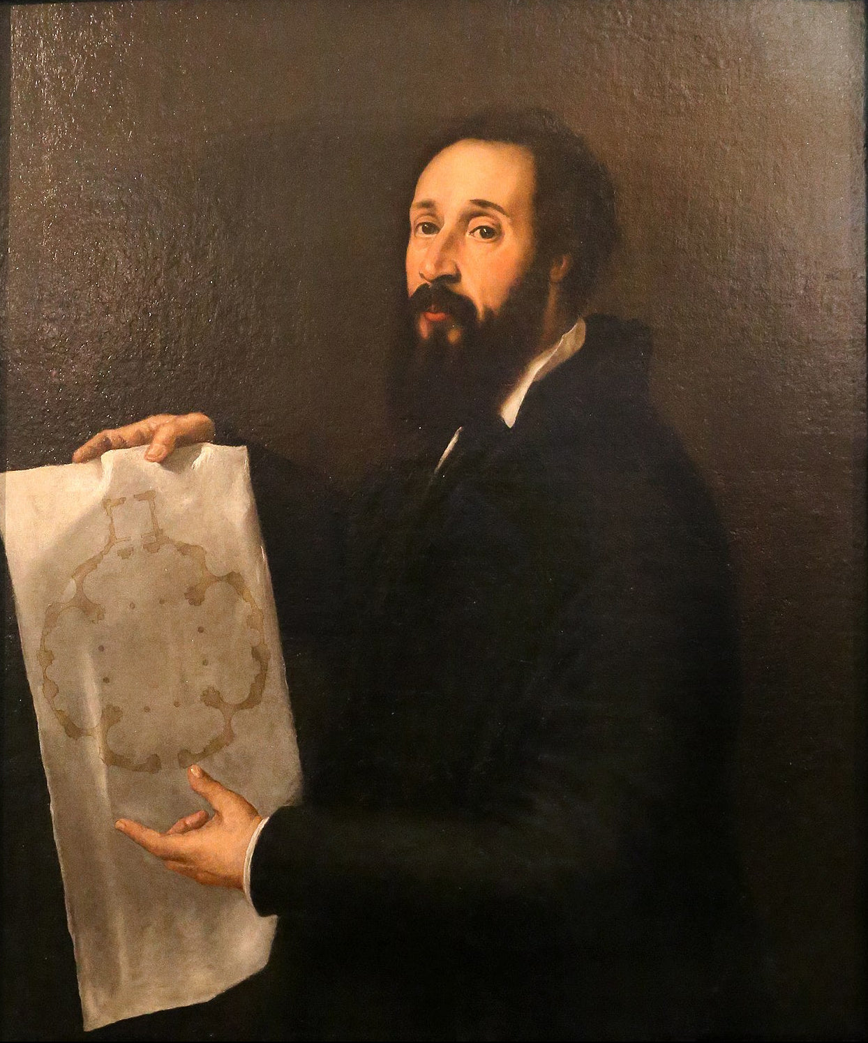 Portrait of Giulio Romano by Titian – Renaissance Masterpiece, Palazzo del Te Mantua. Portrait of a man holding a map against a dark background