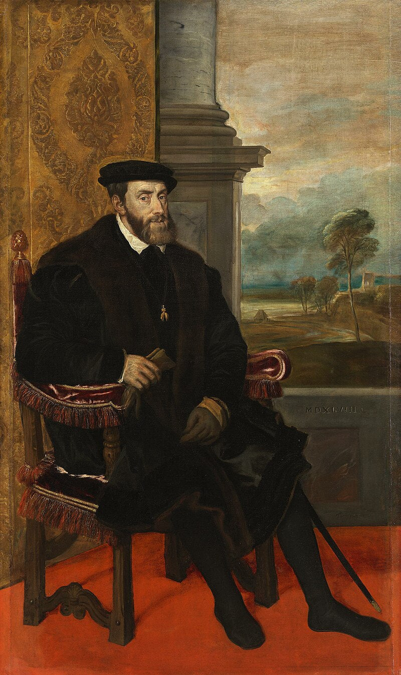 Portrait of Charles V by Lambert Sustris – Renaissance Imperial Portrait, Alte Pinakothek Munich. Portrait of a man in a dark coat sitting in a room with a landscape painting in the background.