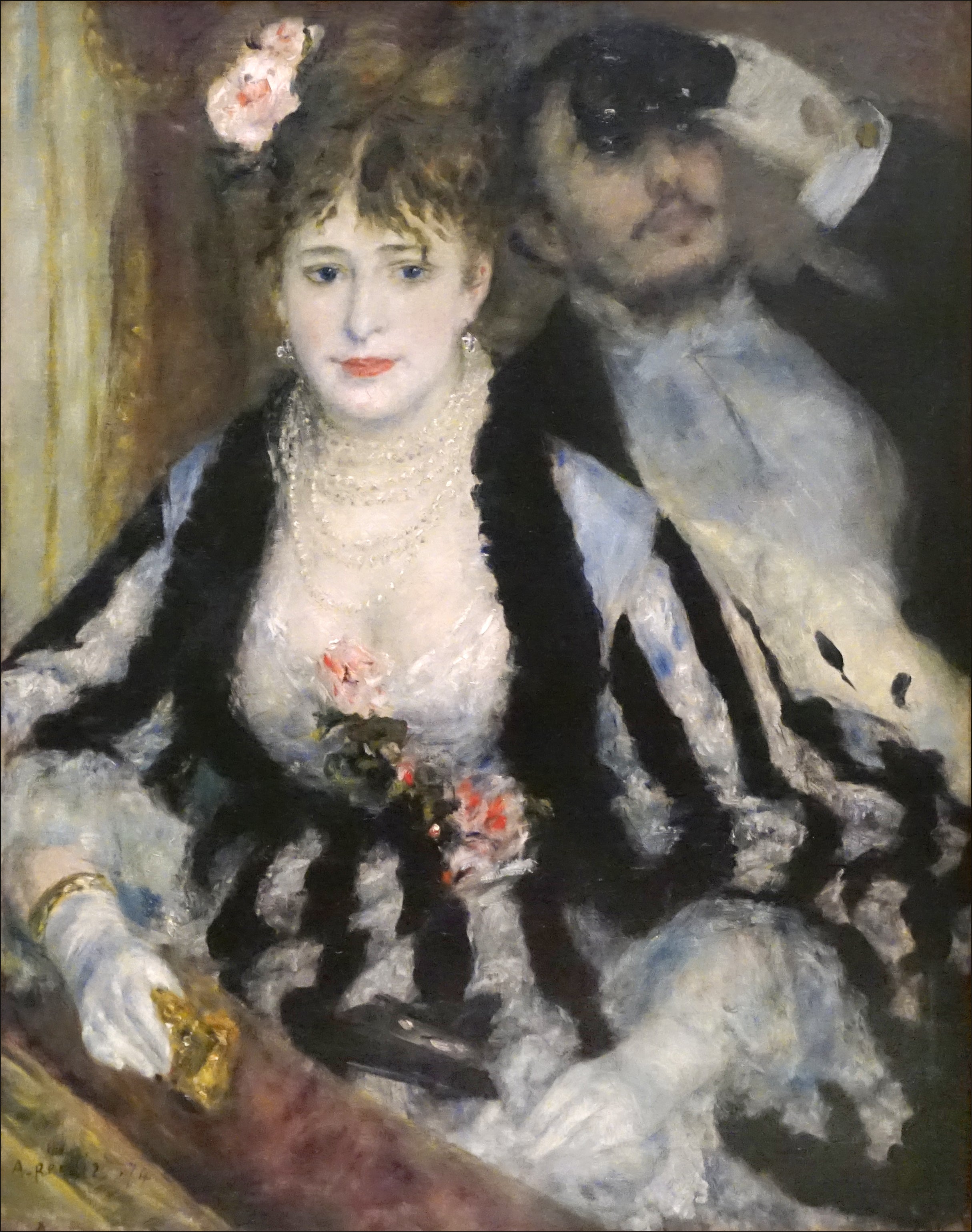 Painting of a couple in formal attire with a woman holding a fan. La Loge ('The Theatre Box') is an 1874 oil painting by Pierre-Auguste Renoir. It is part of the collection at the Courtauld Institute of Art in London.