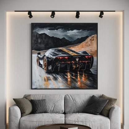 Framed painting of a sports car on a wall above a sofa
