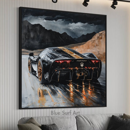 Framed painting of a black sports car on a mountain road with 'Blue Surf Art' branding.